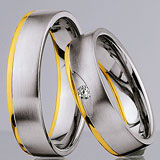 Marrying 585 Weiss-Gelbgold, 5,50 mm Breite, seidenmatt / poliert, 1 Brillant 0,045 ct W/SI,